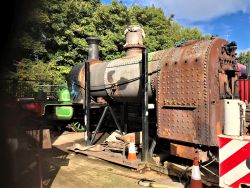 view of removed boiler sitting in cradle