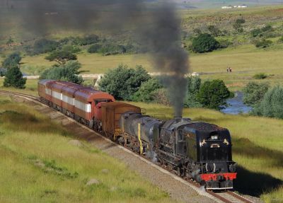 GMAM Garrett No.4074, on the Cape Gauge preservation line from Creighton to Riverside, in Natal. – March-April 2017 (Colin Miell) Garrett steam locomotive hauling a passenger train across the South African landscape.