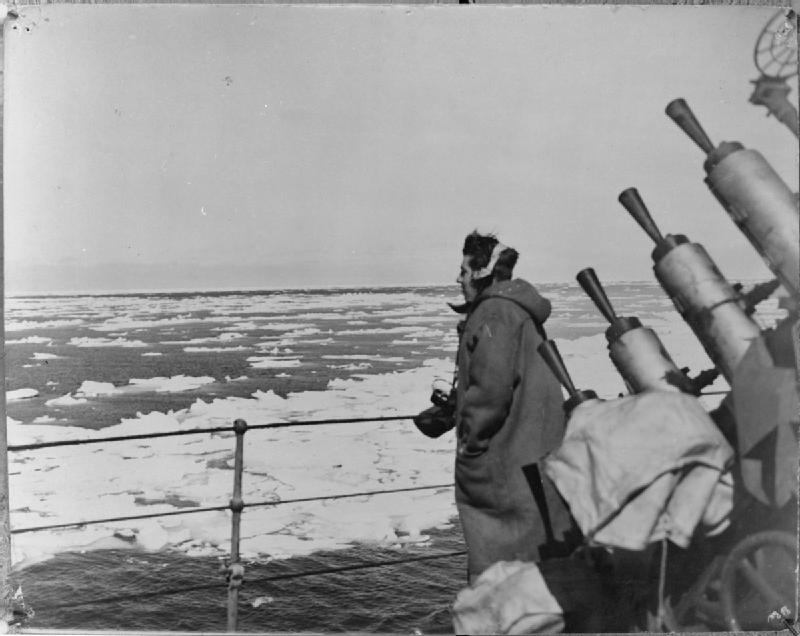 Naval crew member overlooks an arctic ice flow during WW2.