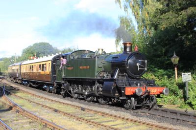 Great Western Railway 2-6-2T number 5164 arriving at Highley on the Severn Valley Railway with a train from Bridgnorth. – Geof Sheppard, 21 September 2013. – CC-by-SA 3.0, via Wikimedia Commons GWR Prairie tank loco with 2-coach passenger train