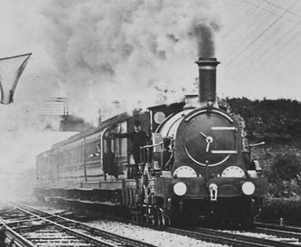 1892 photo of a broad gauge passenger train hauled by a steam locomotive
