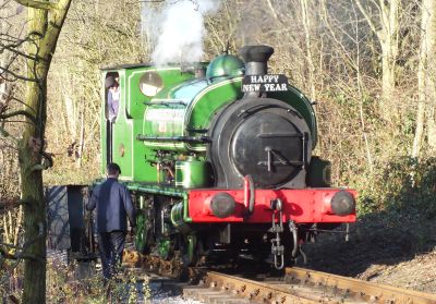 Steam locomotive 'Slough Estates No.3' on a tree-lined railway