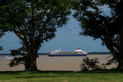 Fred. Olsen's MS 'Braemar' at anchor in the muddy waters of the Amazon, off the Brazilian town of Parintins, some 600 miles inland from the open sea. (Colin Miell – Feb 2018) 0-4-4T steam locomotive on 2-coach passenger train at a small halt station high up a grassy embankment