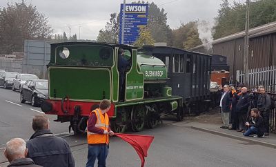 Slough Estates No. 3, masquerading as Blenkinsop, hauling a freight train over the road crossing to the Balm Road branch on the Middleton Railway, during the 'Last Coals to Leeds' commemoration of the 50th anniversary of the closure of Middleton Broom Colliery in 1968. (Peter Jewell – 30 Sept 2018) 0-6-0 saddle tank steam locomotive Slough Estates No. 3, masquerading as Blenkinsop, pulling a short freight train bunker-first over the road crossing to the Balm Road branch on the Middleton Railway, September 2018, as part of the 'Last Coals to Leeds' commemoration of the 50th anniversary of the closure of Middleton Broom Colliery in 1968.