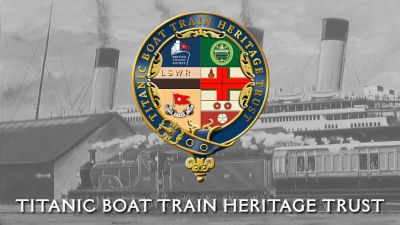 Titanic Boat Train Heritage Trust – (from the Trust's website) The crest of the Titanic Boat Train Heritage Trust, superimposed on a painting of a vintage steam train on the dockside adjacent to ocean liner RMS Titanic