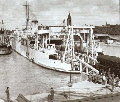WD loco being unloaded at Dieppe 1944 from WW1 Ferry A large War Department steam locomotive being unloaded from a WW1 train ferry in 1944.