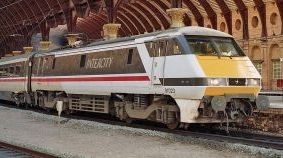 The classic view at York. 91023 working the 1700 from London Kings Cross to Edinburgh on Monday 30th August 1993. – Carl Looker A partly-streamlined electric passenger loco under a dramatic overall station roof.