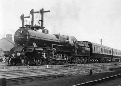 LMS Hughes 5P 4-6-0 10474, heading a train of the latest coaches, participating in the Cavalcade at the Darlington Railway Centenary Exhibition, 2nd July 1925. Image Credit: LCGB/NRM Ken Nunn Collection Archive photo from 1925, showing a smart 4-6-0 tender steam locomotive and some contemporary, wooden-panelled, coaches.