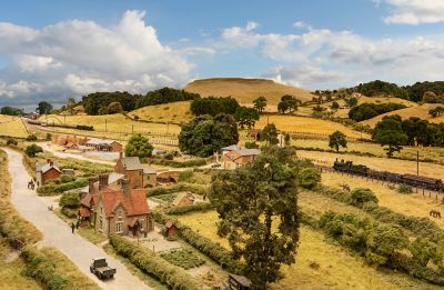 Panoramic view of a model recreating the sparsely-populated countryside of rural England in the 1920s.