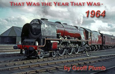 A large 4-6-2 express passenger steam locomotive with tender simmers gently at the head of a passenger train waiting in an expansive works sidings complex.