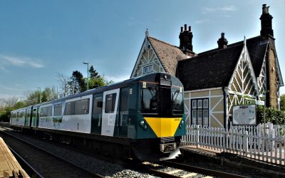 Former Underground train, now converted to a 2-car diesel electric, sits at a traditional country station