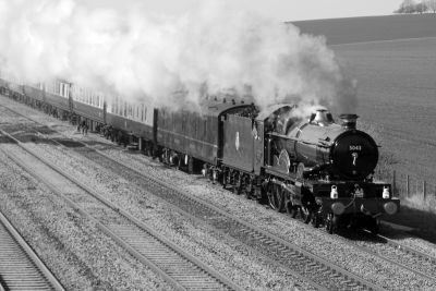 'Earl Of Mount Edgecombe' with a Pullman train, near Cholsey on the GW main line (Up Relief line). 'Earl Of Mount Edgecombe' with a Pullman train, near Cholsey on the GW main line (Up Relief line).