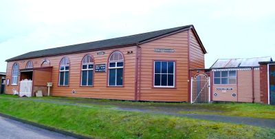 'The Manor', the SWRS meeting place adjacent to Slough Station. A wooden, single-storey, Victorian building with large windows, in GWR colours.
