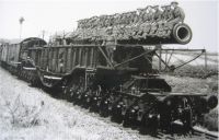 'Boche Buster', the 18in railway gun normally stationed in Bishopsbourne Tunnel, is pictured with its crew at Ashford, Kent. railway gun 'Boche Buster'